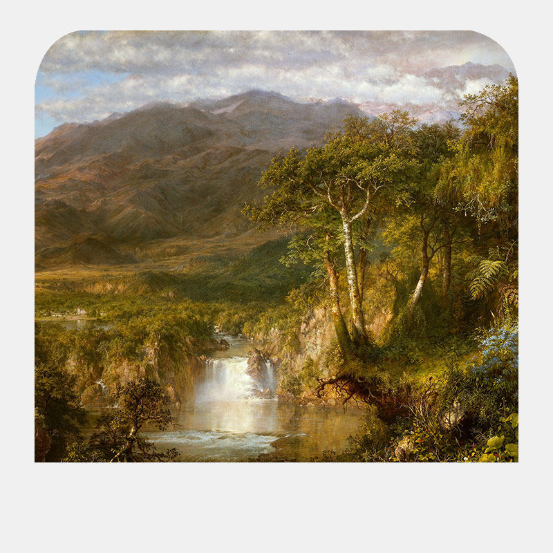 Scenery of a waterfall surrounded by foliage and mountains.
